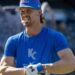 Kansas City Royals shortstop Bobby Witt Jr. (7) holds a batting accessory in his mouth during batting practice before a baseball game against the Houston Astros on Friday, June 12, 2026, at Kauffman Stadium in Kansas City.