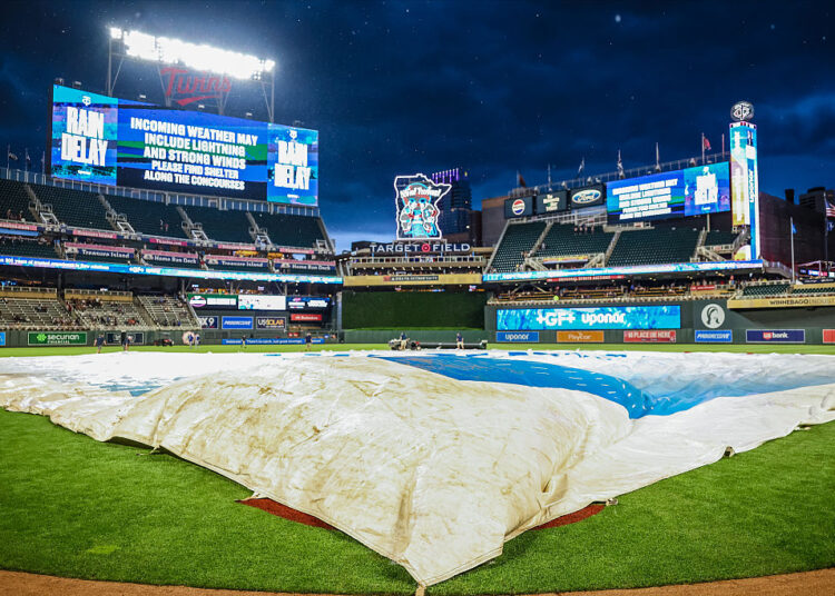 MINNEAPOLIS, MN - JUNE 04: A general view of the field with a tarp covering it during a weather delay of the game between the Kansas City Royals and the Minnesota Twins at Target Field on Thursday, June 4, 2026 in Minneapolis, Minnesota. (Photo by Andrew Ritter/MLB Photos via Getty Images)