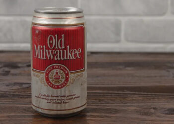 vintage can of Old Milwaukee beer against brick wall