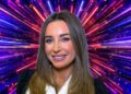 Dani Dyer in front of a firework-like background