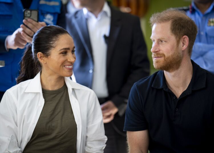 Harry and Meghan earlier this year during their visit to Jordan