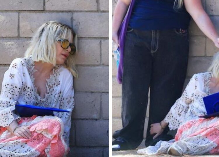 TV star Tori Spelling spotted slumped on the floor at daughter Stella’s graduation