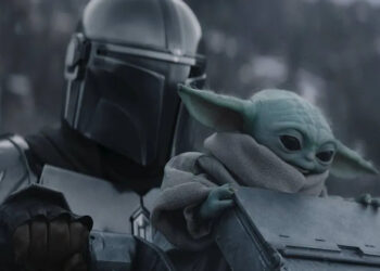 Pedro Pascal's Din Djarin and Baby Yoda in the snow in The Mandalorian and Grogu .