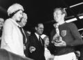 Bobby Moore receives the Jules Rimet World Cup trophy from the Queen of England after beating West Germany in the final in 1966.