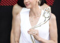 Princess Charlene holding a trophy