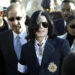 Michael Jackson, center, his lawyer Mark Geragos and sister Janet Jackson arrive for the pop star's arraignment on child molestation charges on Jan. 16, 2004, in Santa Maria, Calif.
