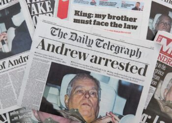 multiple british newspapers are displayed showing a front page image and accompanying story about andrew mountbatten windsor