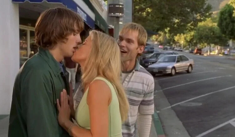 Ashton Kutcher and Kristy Swanson kissing in