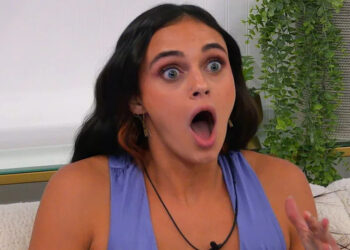 Madelyn reacting with surprise in her room on The Circle.