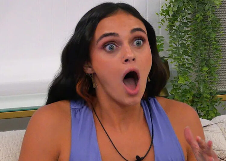 Madelyn reacting with surprise in her room on The Circle.