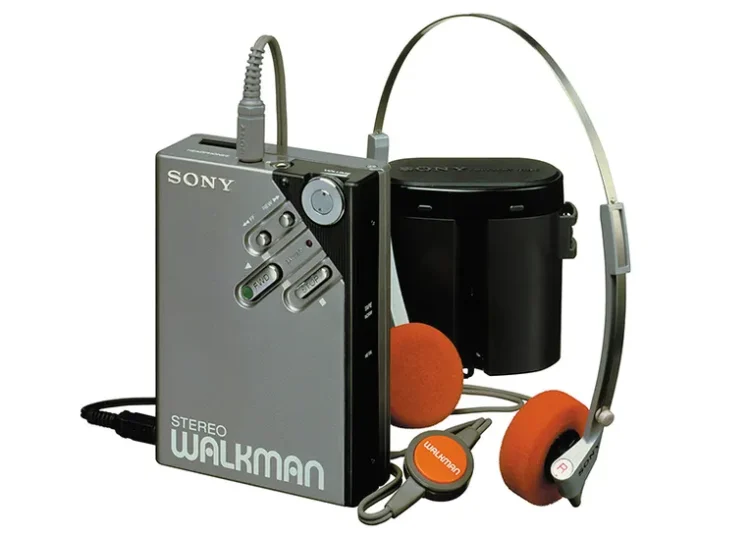 A second-generation Sony Walkman with on-ear headphones on a white background.