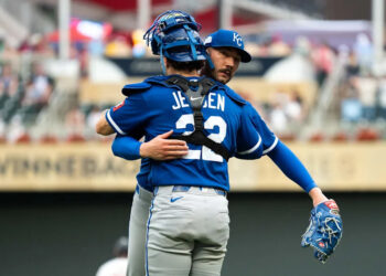 Lucas Erceg #60 of the Kansas City Royals embraces Carter Jensen #22 after the game against the Minnesota Twins at Target Field on June 7, 2026 in Minneapolis, Minnesota. Erceg earned a save as the Royals defeated the Twins 6-5.