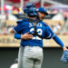 Lucas Erceg #60 of the Kansas City Royals embraces Carter Jensen #22 after the game against the Minnesota Twins at Target Field on June 7, 2026 in Minneapolis, Minnesota. Erceg earned a save as the Royals defeated the Twins 6-5.