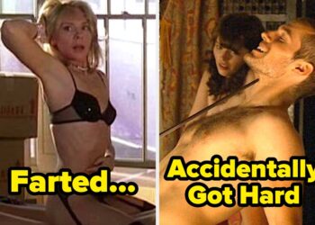 A man and Kim Cattrall are on a bed surrounded by boxes. The woman is in lingerie, and the man is shirtless