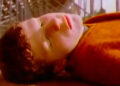 Jesse Eisenberg as Kenny lying on the ground outside in Get Real