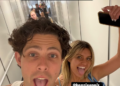Two friends making playful faces while walking down a hallway, with text overlay saying "LA WE ARE IN YOU.