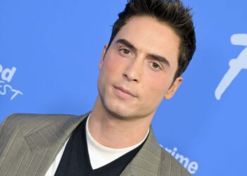 Benito Skinner wears nothing but a robe in sexy new selfie