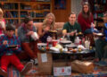 Sheldon sits in his spot while eating dinner with friends