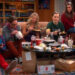 Sheldon sits in his spot while eating dinner with friends
