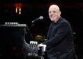 Billy Joel performs on stage at Madison Square Garden.
