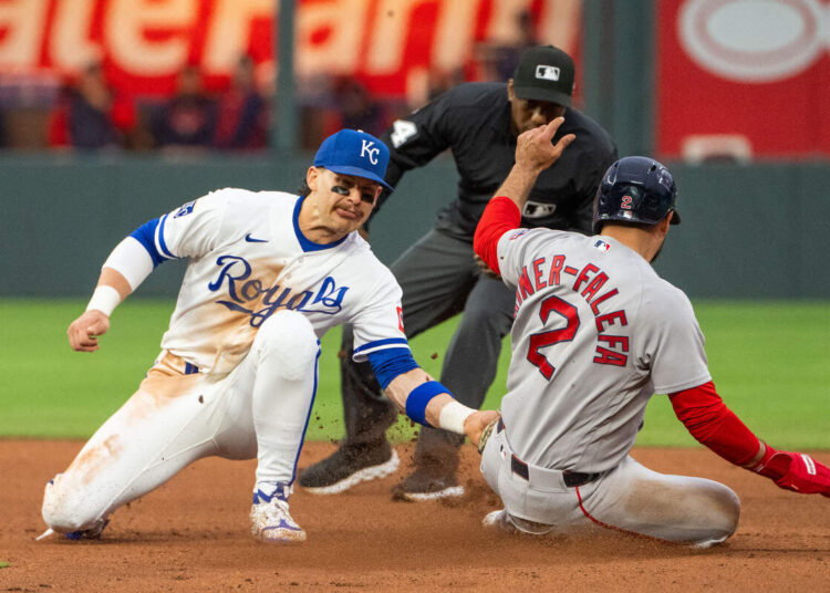 Kansas City Royals shortstop Bobby Witt Jr., left, tags out Boston Red Sox second baseman Isiah Kiner-Falefa during a game on Tuesday, May 19, 2026, at Kauffman Stadium.