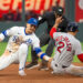 Kansas City Royals shortstop Bobby Witt Jr., left, tags out Boston Red Sox second baseman Isiah Kiner-Falefa during a game on Tuesday, May 19, 2026, at Kauffman Stadium.