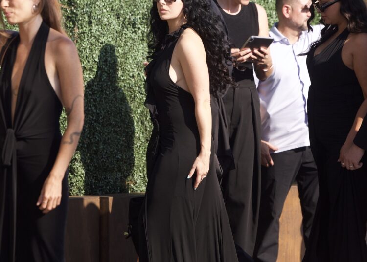 Charli XCX wears a little black dress to attend Matty Healy and fiancée Gabbriette Bechtel's wedding in Los Angeles