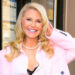 Christie Brinkley wearing a pink blazer smiling in New York City.