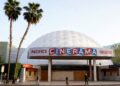 People appear outside the Cinerama Dome movie theater, April 12, 2021, in Los Angeles.  (AP Photo/Chris Pizzello)
