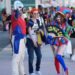 Dorian Reyes Black of Los Angeles, dressed as Peacemaker, from left, Connor Bright of Los Angeles, dressed as Archie from "Riverdale" and Emily Rose of Los Angeles, dressed as Pomni from "The Amazing Digital Circus" attend Comic-Con International on Thursday in San Diego. (AP Photo/Chris Pizzello)