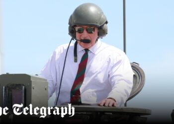Commander at the wheel: King rides in tank during regiment visit