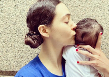 Emmy Rossum kissing her babyCredit: Emmy Rossum/Instagram