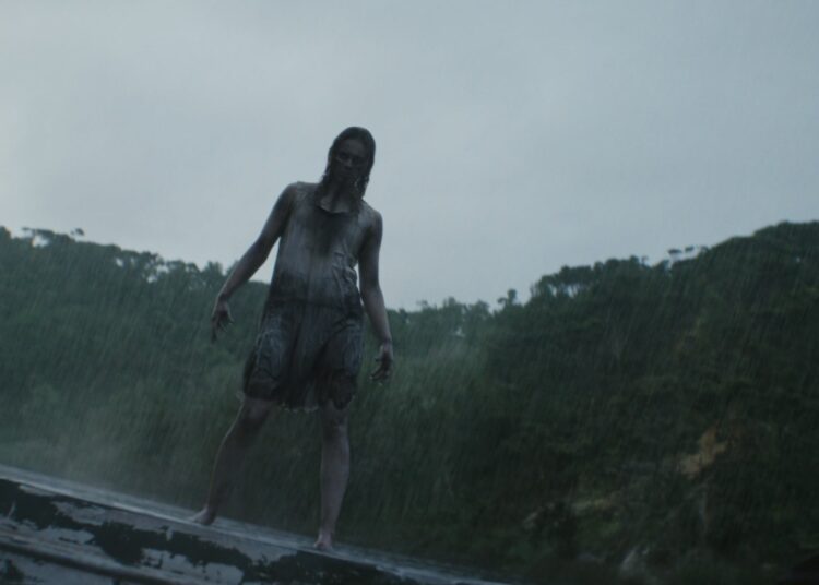 A Deadite stands on a boat in