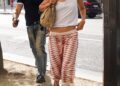 Gigi Hadid wore a white tank top from Prada with culottes and the Mary Janes shoe trend