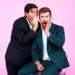 Danny Murphy and Evan Real, hosts of Page Six's "Virtual Reali-Tea," posing as if sharing a secret.
