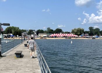 Pier with beach and striped tent