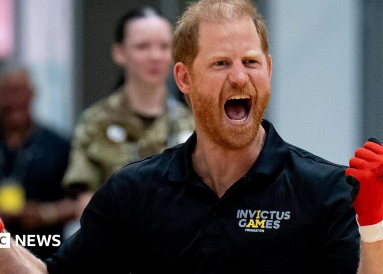Prince Harry wearing gloves as as he played wheelchair rugby at an event in Birmingham for the Invictus Games
