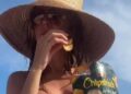 Heidi Klum Goes Topless in Nothing but Bikini Bottoms While Eating Chips
