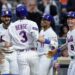 New York Mets outfielder Carson Benge celebrates with teammates during an MLB game.