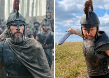 Matt Damon and stuntwoman Deyvn Dalton in costume in "The Odyssey." Side-by-side images comparing a bearded warrior in a crested helmet from a historical epic film with the stunt performer in matching armor and helmet holding a short sword in a grassy field.