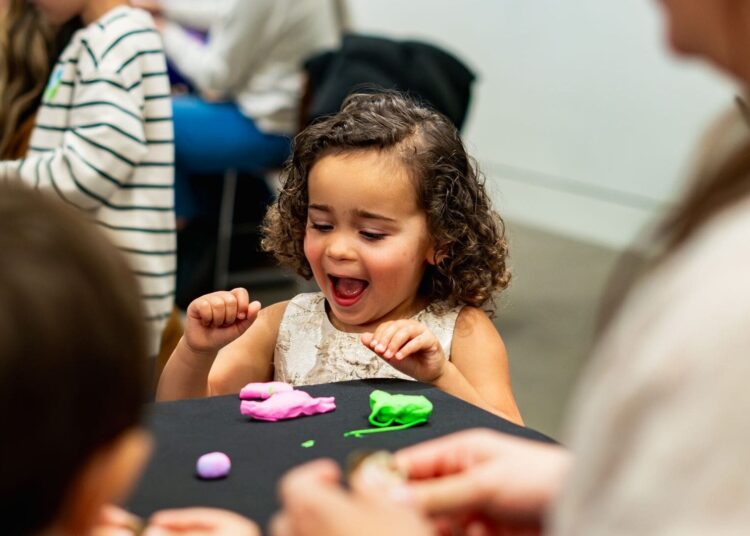 Girl plays with play dough