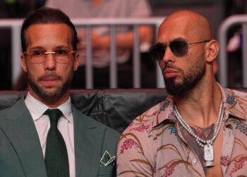 Andrew Tate, right, and his brother Tristan arrive an event, April 11, 2026, in Miami. (AP Photo/Julia Demaree Nikhinson, Pool, File)