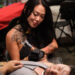 Tattoo artist at Long Beach Tattoo Arts Festival 2026 at the Long Beach Entertainment Center.