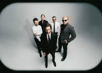 Interpol stare down AI on atmospheric new single 'Iron City'