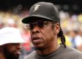 Jay-Z looks on ahead of the start the World Cup round of 16 soccer match between Brazil and Norway in East Rutherford, N.J., near New York, Sunday, July 5, 2026.