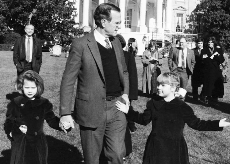 President George H. W. Bush with his granddaughters, Barbara (left) and Jenna, on the south lawn of the White House in 1989Credit: Bettmann Archive