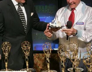 Alex Trebek and Johnny Gilbert celebrate 'Jeopardy' being inducted into the Guinness Book of World Records in 2005Credit: E. Charbonneau/WireImage