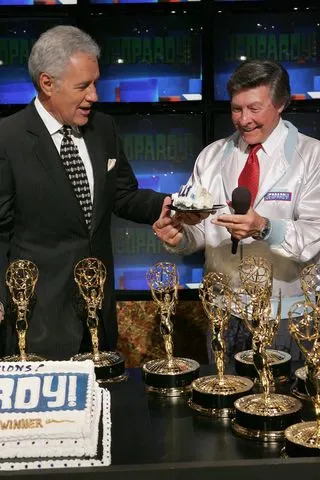 Alex Trebek and Johnny Gilbert celebrate 'Jeopardy' being inducted into the Guinness Book of World Records in 2005Credit: E. Charbonneau/WireImage