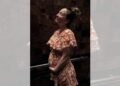 Kaley Cuoco posed in a floral dress while cradling her baby bump in one of the snapshots.@KALEYCUOCO/INSTAGRAM