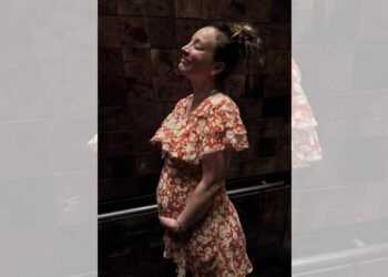 Kaley Cuoco posed in a floral dress while cradling her baby bump in one of the snapshots.@KALEYCUOCO/INSTAGRAM